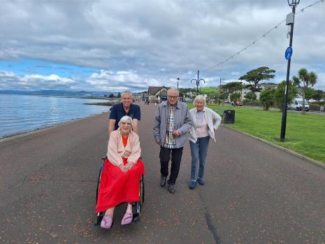 esidents-enjoying-a-walk-by-the-sea