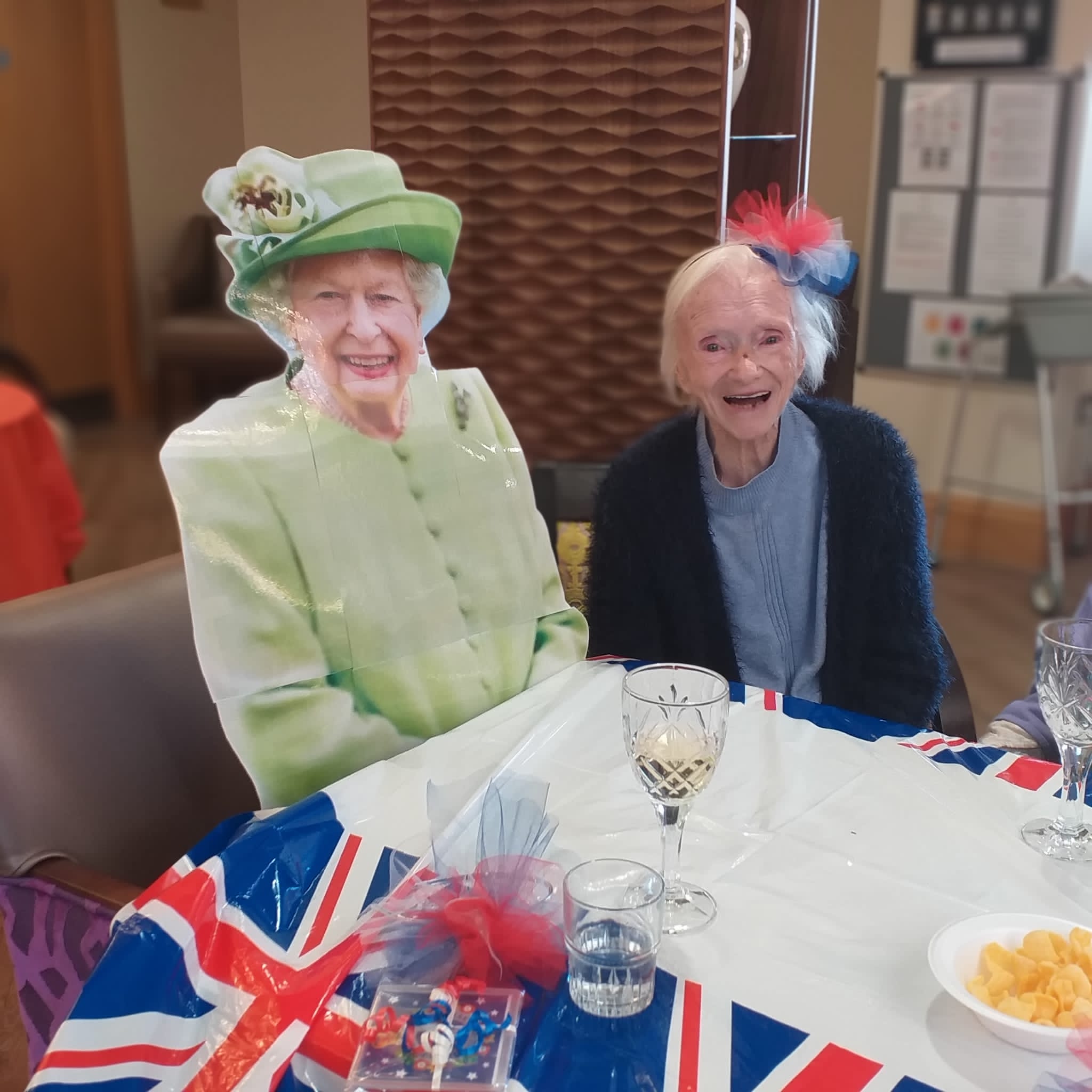 Resident Enjoying Royal Celebration With Queen Cutout