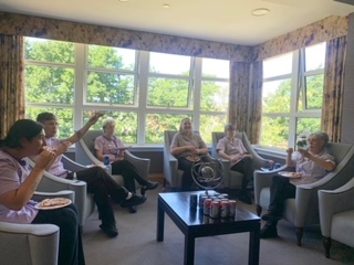 Residents &amp; Staff Enjoying Pizza