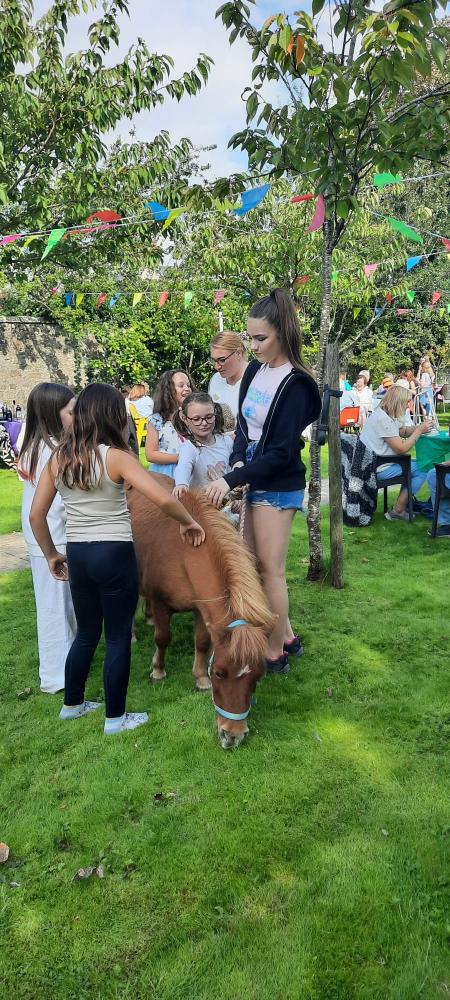 Templeton House Care Home's Summer Fete raises funds for an interactive table, enhancing the lives of residents with meaningful engagement and activities