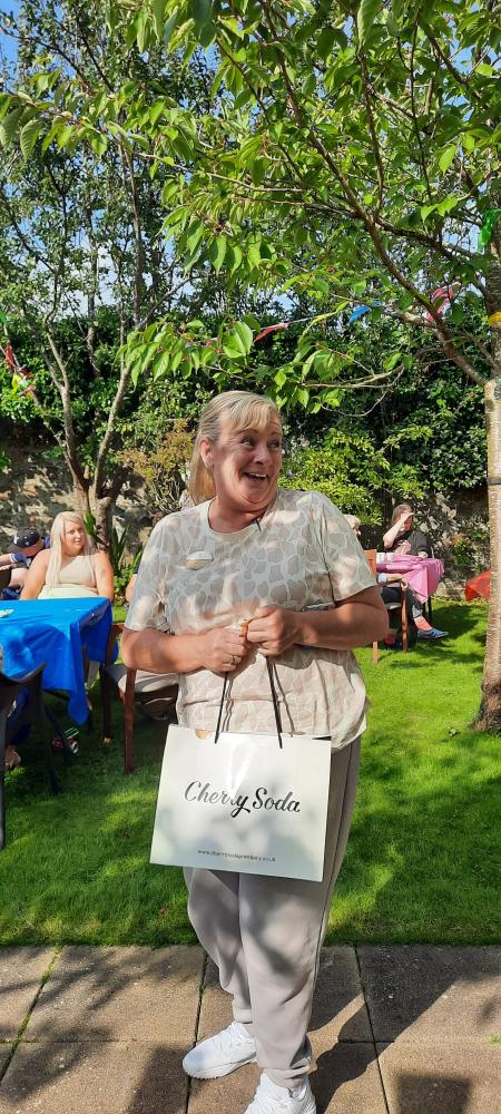 Templeton House Care Home's Summer Fete raises funds for an interactive table, enhancing the lives of residents with meaningful engagement and activities